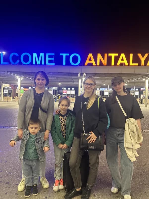 Family arrival at Welcome to Antalya sign