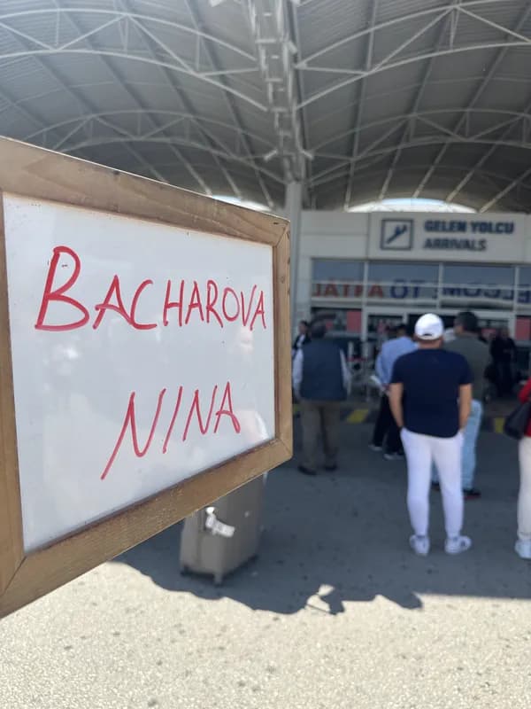 Personal name board at arrivals