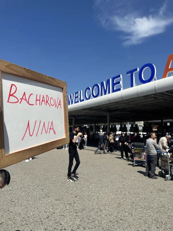 Name board greeting at airport